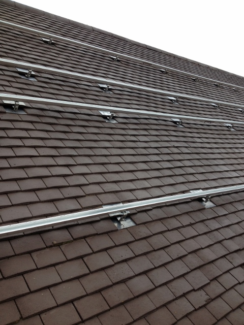 An example of solar panel rails mounted into a Plain Tile Roof